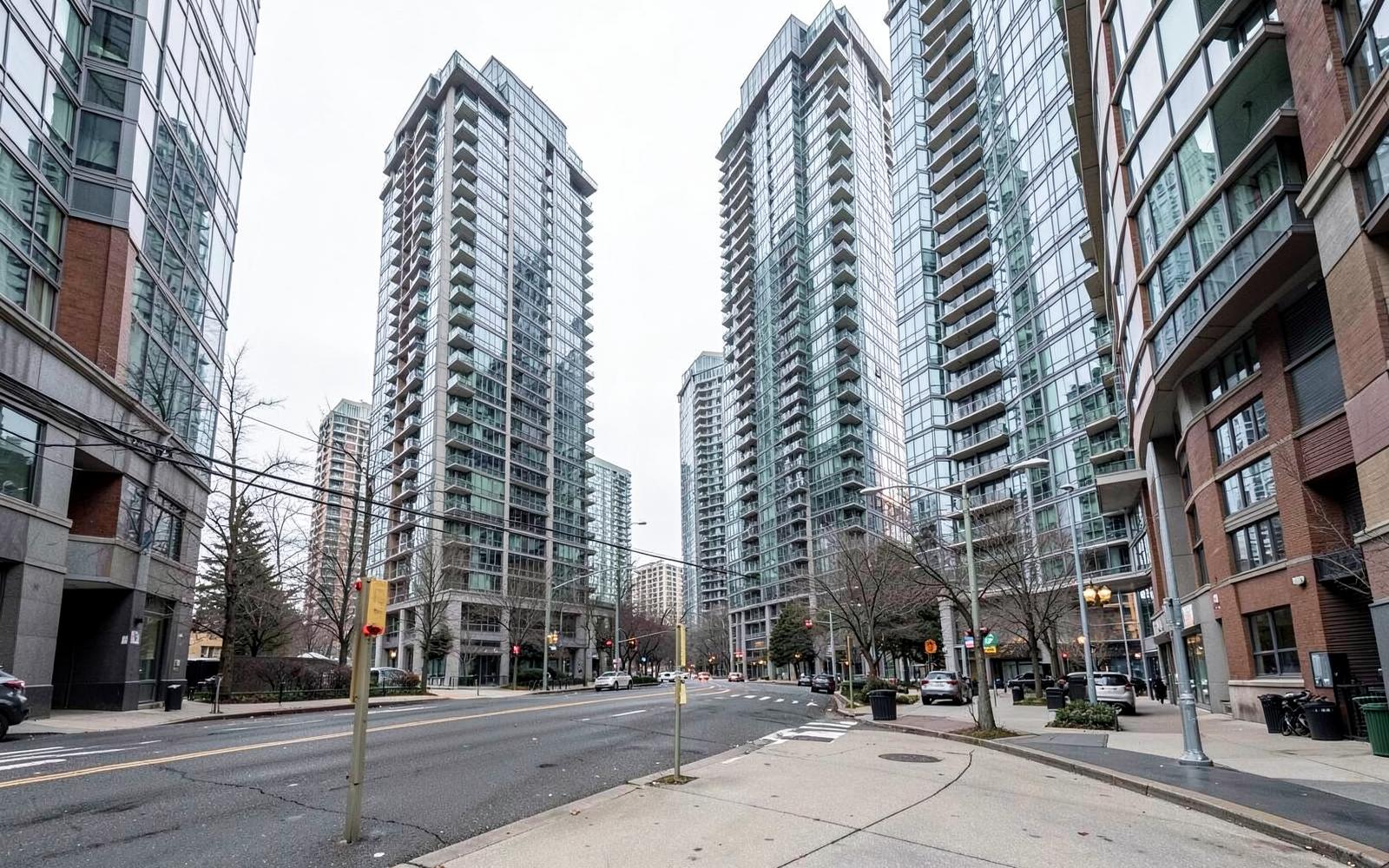 Modern condominium towers along a quiet Toronto street